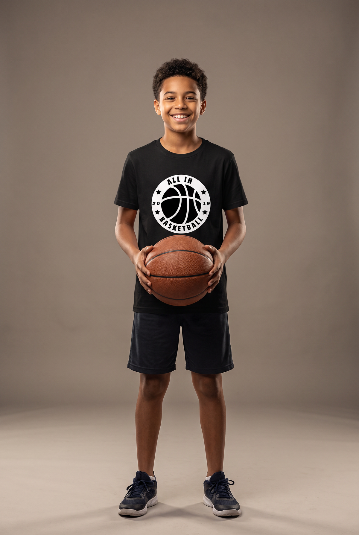 All In badge youth tee — editorial, worn by young athlete