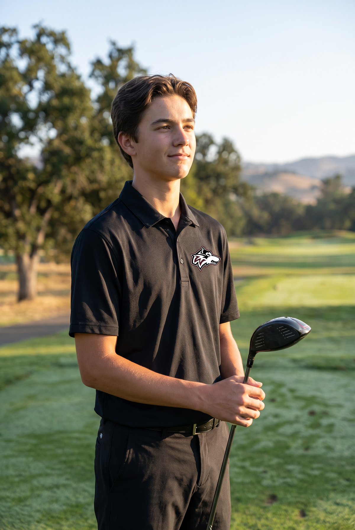 Woodcreek Boys Golf Polo in Black, second view at sunrise