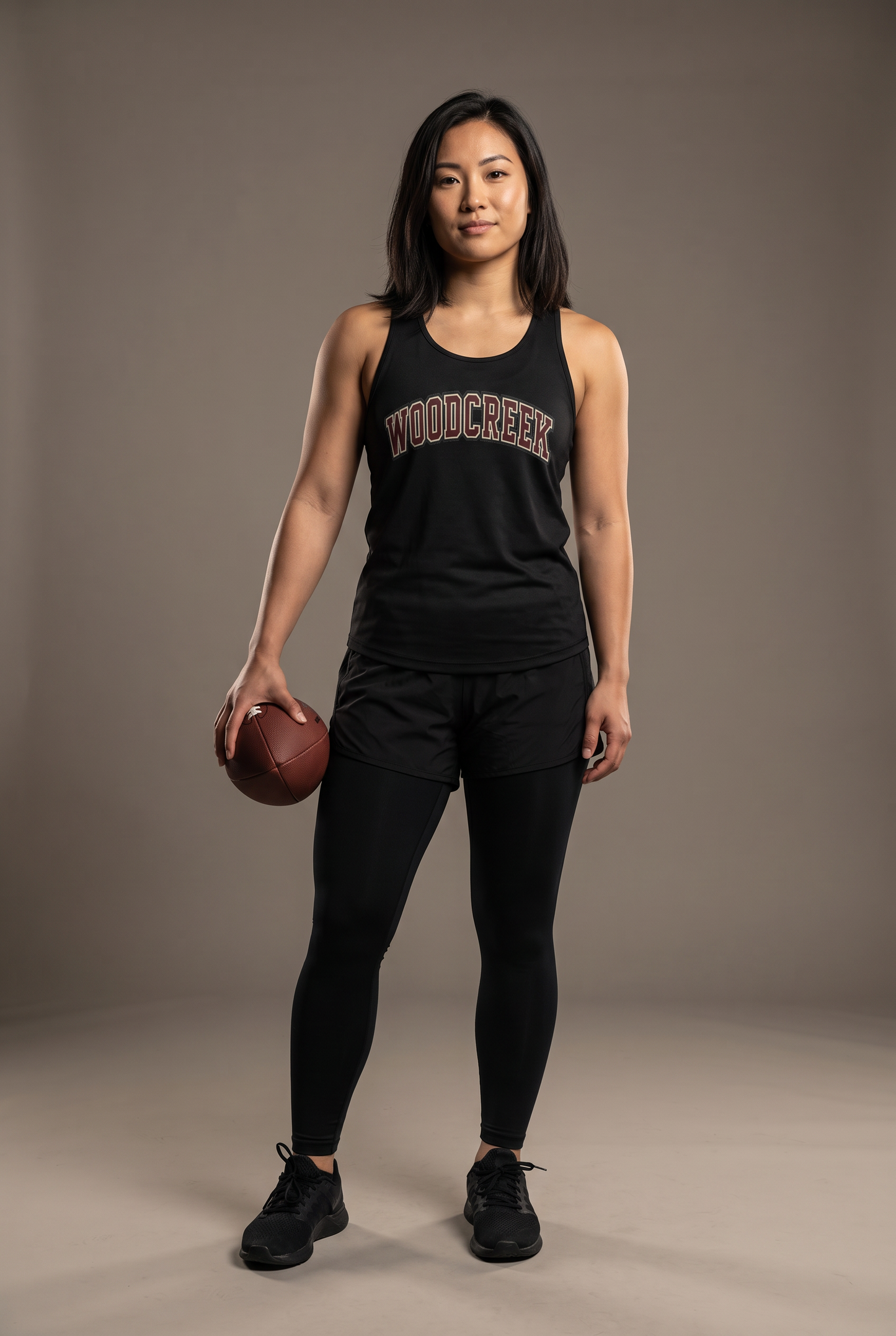 Woodcreek Flag Football college letter women's tank — editorial, worn by athlete