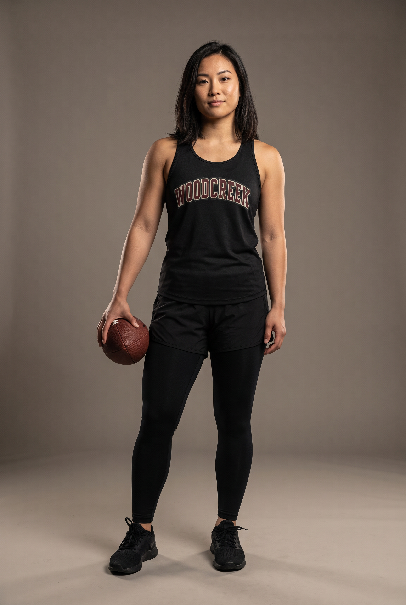 Woodcreek Flag Football college letter women's tank — editorial, worn by athlete