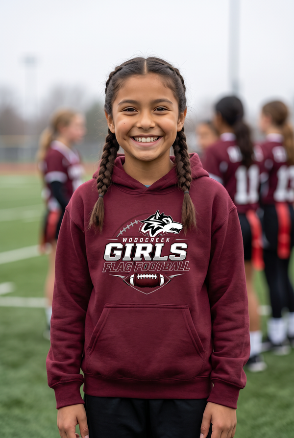 Woodcreek Girls Flag Football Youth Hoodie in Maroon, worn on the sideline